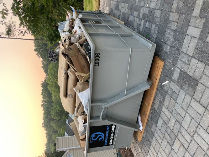 10 Yard Dumpster Rental Filled With Cartons